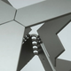 Illustration for article titled Futuristic Origami Desk Cut and Folded from a Single Sheet of Steel